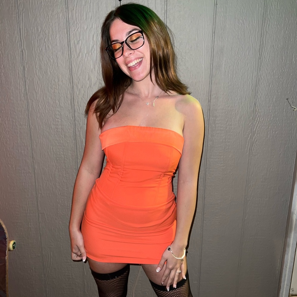Strapless orange corset dress.